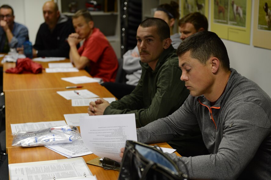 David Esra, 52nd Force Support Squadron combat fitness programs manager from Jackson, Tenn., looks over itineraries and maps for the Eifel to Eiffel bicycle trip at Spangdahlem Air Base, Germany, May 7, 2014. Esra drove one of the support vehicles for Airmen and civilians who biked from the Eifel region to the Eiffel Tower. (U.S. Airmen 1st Kyle Gese/Released)