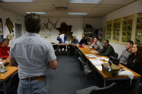Anthony Williams, 52nd Force Support Squadron outdoor recreation director, speaks to Airmen and civilians about support on their bicycle ride to the Eiffel Tower at Spangdahlem Air Base, Germany, May 7, 2014. Staff from the outdoor recreation office provided logistical support to include buses, food and bicycle repair. (U.S. Air Force photo by Airman 1st Class Kyle Gese/Released)