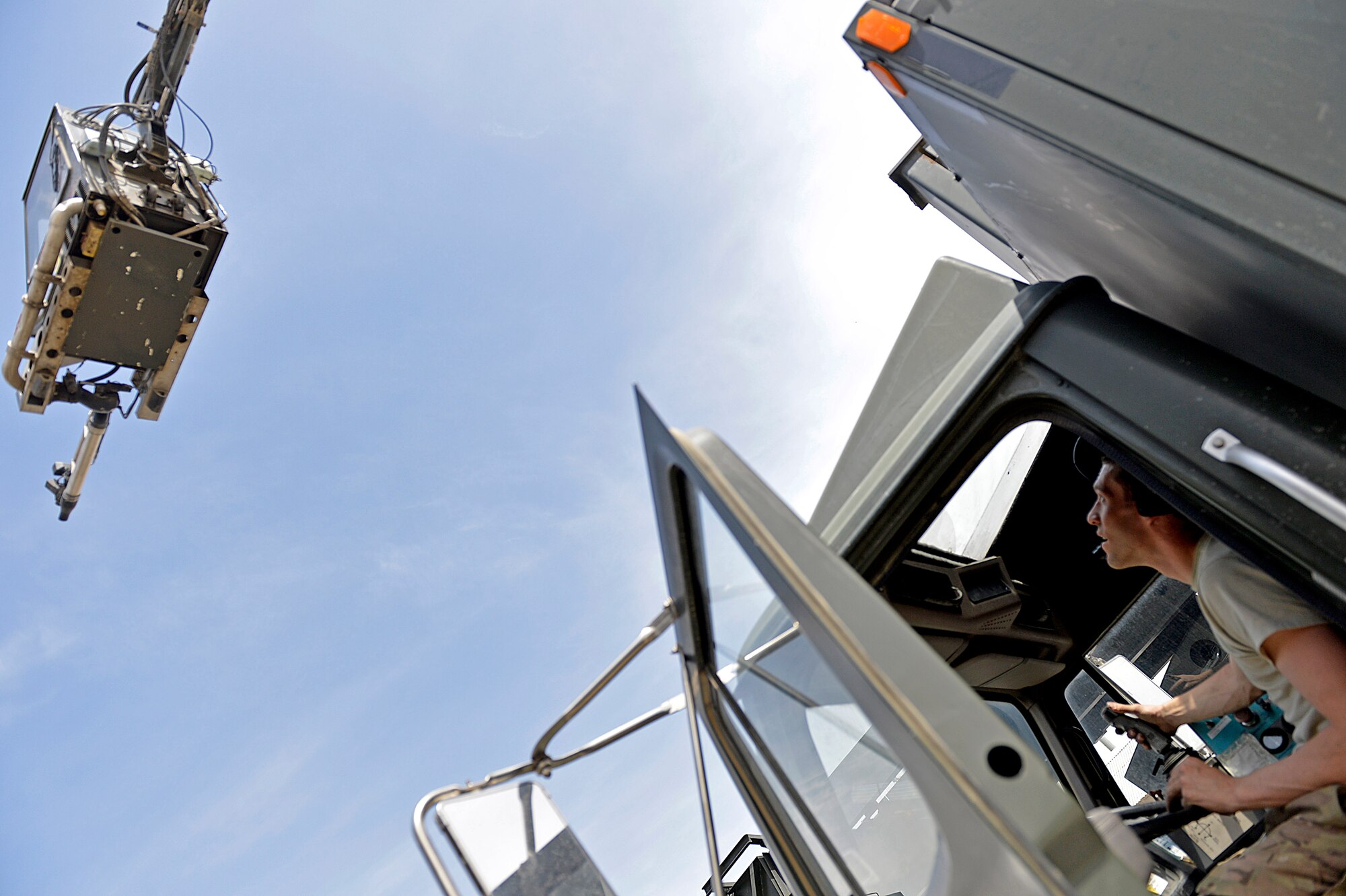 Staff Sgt. Cody McDonald, 455th Expeditionary Logistics Readiness Squadron vehicle maintenance journeyman, function checks a de-icer truck May 7, 2014 at Bagram Airfield, Afghanistan.  As a vehicle maintainer, McDonald is trained to repair, inspect and maintain vehicles that are essential to the daily mission.  McDonald is deployed from Joint Base Elmendorf-Richardson, Ala. and a native of Chesterfield, Mich.  (U.S. Air Force photo by Staff Sgt. Evelyn Chavez/Released)