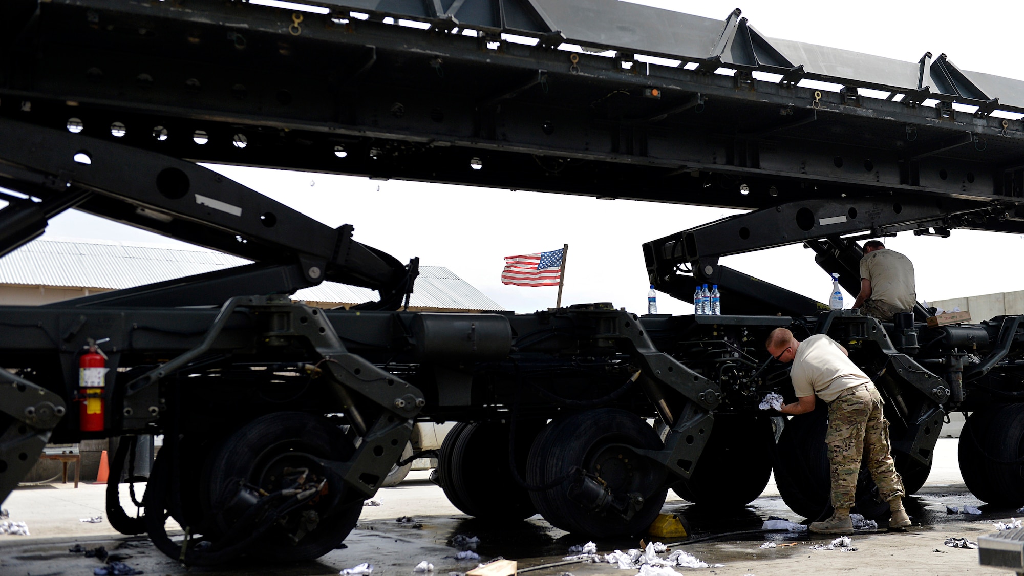 Staff Sgt. Jay Csurilla, 455th Expeditionary Logistics Readiness Squadron vehicle maintenance, helps clean a truck before a vehicle inspection May 7, 2014 at Bagram Airfield, Afghanistan.  Vehicle maintainers repair, inspect and maintain vehicles that are essential to the daily mission.  Csurilla is deployed from Aviano Air Base, Italy and a native of Pittsburgh, Pa. (U.S. Air Force photo by Staff Sgt. Evelyn Chavez/Released)