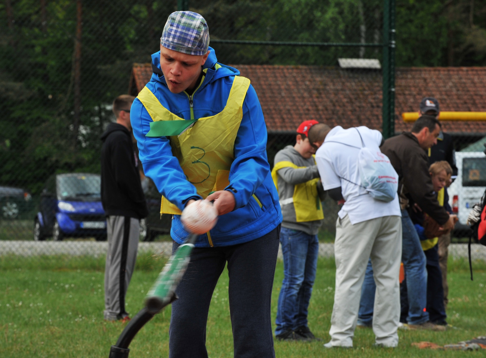 Johnny Karaca, son of retired Army Metin Karaca, hits a homerun during the 2014 Spring Special Olympics began in Pulaski Park, May 9, 2014. This year’s Special Olympics consisted of events such as track and field, soccer, volleyball, basketball, softball, arts and crafts and karaoke; there were also non-competitive events for children ages five to seven who weren’t able compete yet according to the rules. (U.S. Air Force photo/Senior Airman Hailey Haux)