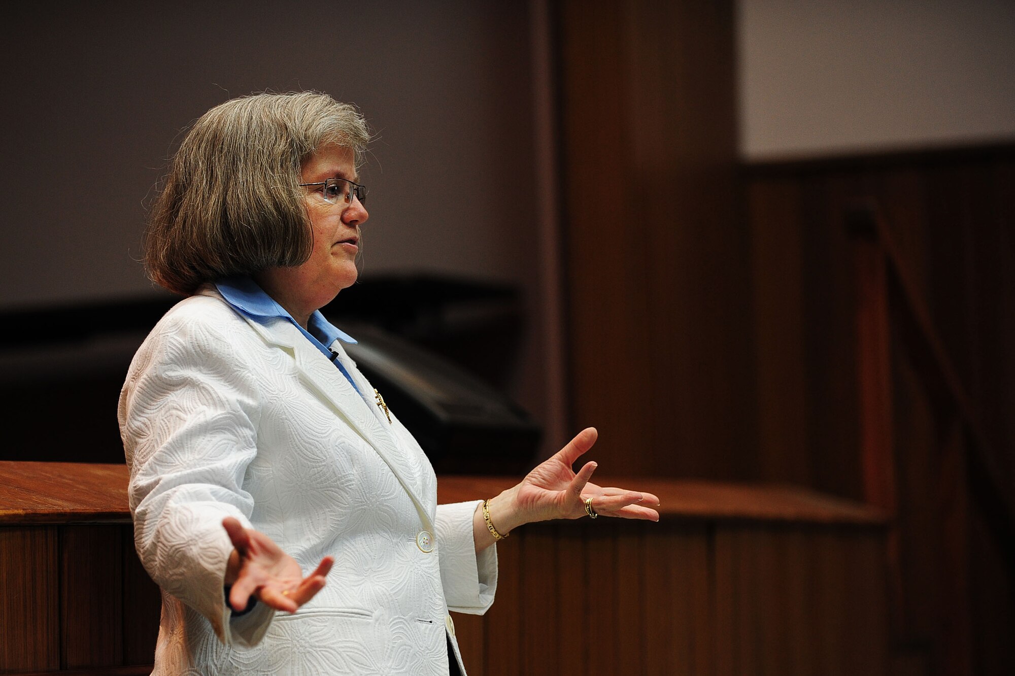 Holly Petraeus, head of the Office of Servicemember Affairs at the Consumer Financial Protection Bureau, speaks to Airmen about financial safety May 13, 2014, Incirlik Air Base, Turkey.  Petraeus offered guidance to keep service members from being victimized by credit card and mortgage companies and various types of loan lenders. (U.S. Air Force photo by Senior Airman Nicole Sikorski/Released)