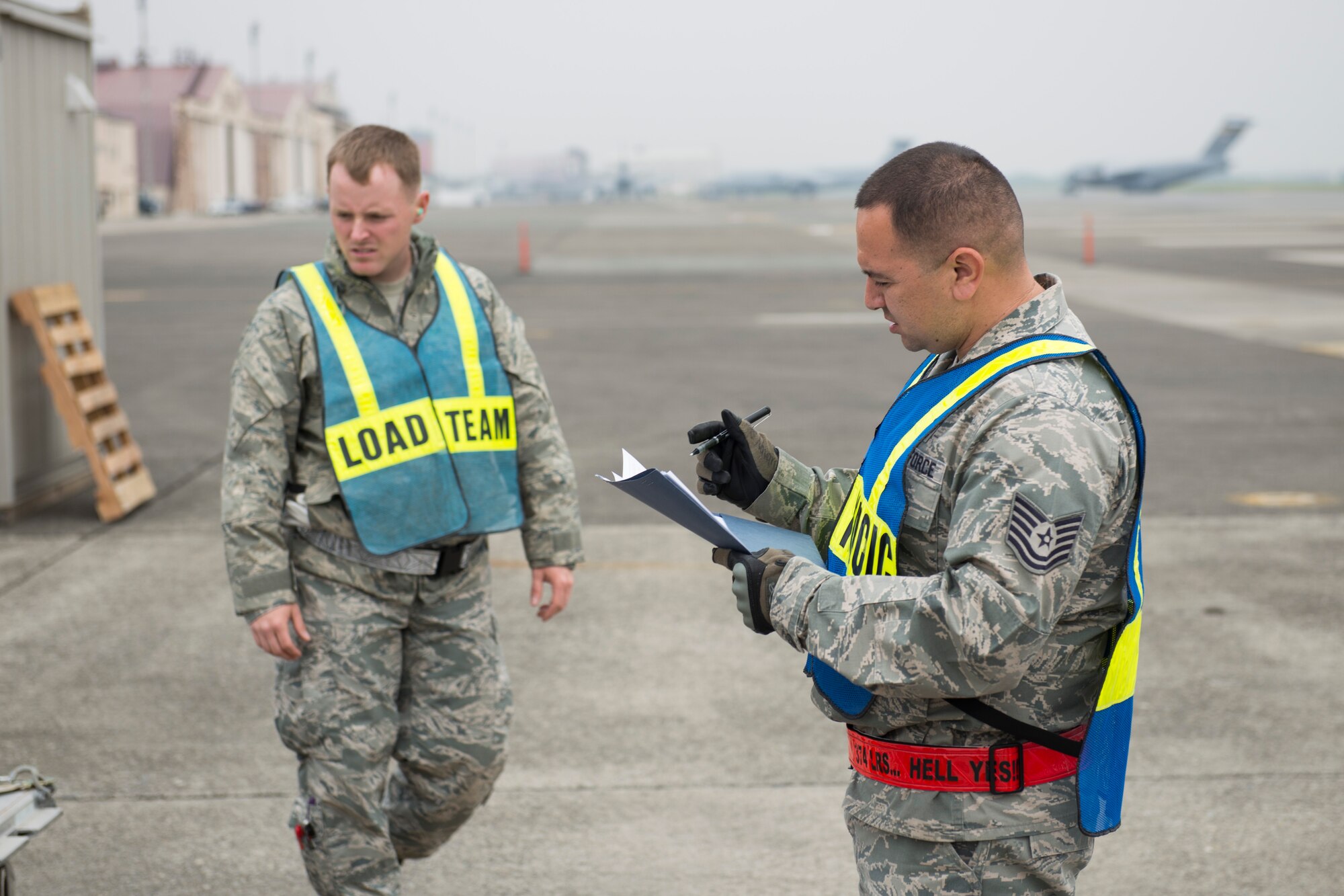 Tech. Sgt. Noe Navarro-Gonzalez, 374th Logistical Readiness Squadron air transportation operations NCO in charge, annotates cargo information during a Samurai Readiness Inspection at Yokota Air Base, Japan, May 13, 2014.  Navarro-Gonzalez led Airmen in his shop and 75 augmentees during the inspection that tested Team Yokota’s response capabilities to provide humanitarian aid and disaster relief efforts in the Pacific region. (U.S. Air Force photo by Staff Sgt. Cody H. Ramirez/Released)