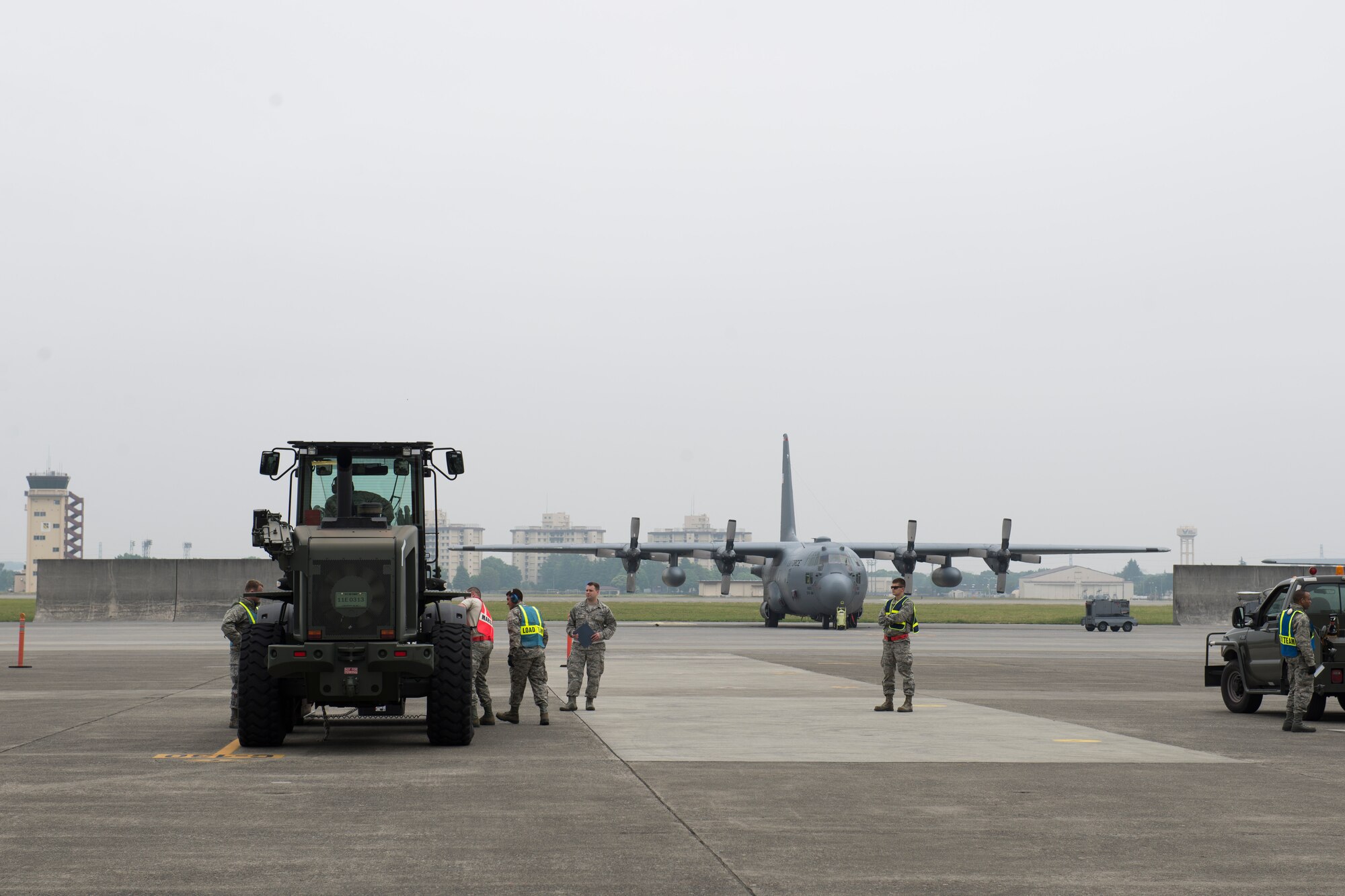 Airmen with the 374th Logistical Readiness Squadron air transportation operations shop as well as augmentees, in-check cargo during a Samurai Readiness Inspection at Yokota Air Base, Japan, May 13, 2014. The inspection included a simulated typhoon scenario to test Team Yokota’s humanitarian aid and disaster relief effort capabilities. (U.S. Air Force photo by Staff Sgt. Cody H. Ramirez/Released)