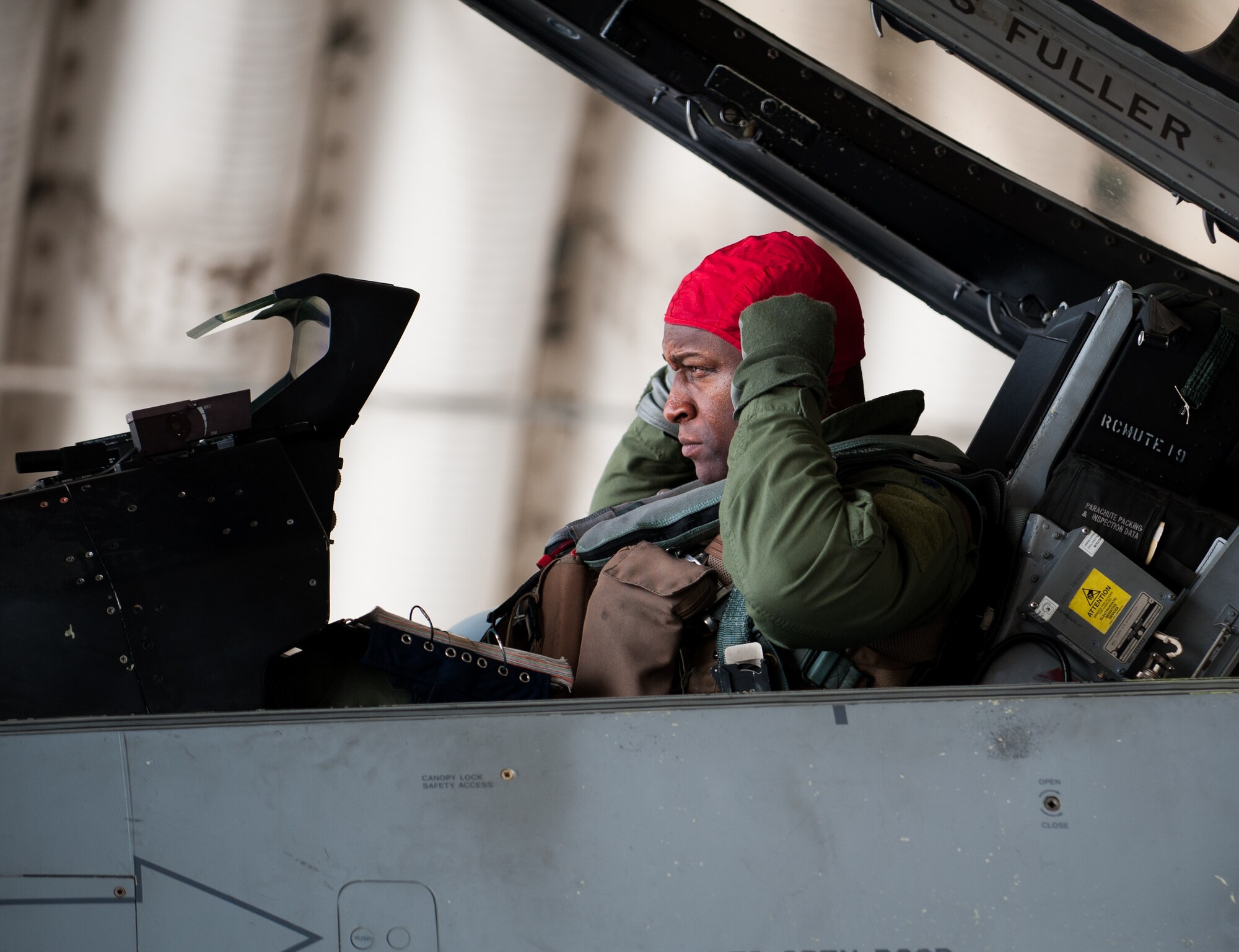 Lt. Col. Henry Jeffress, 80th Fighter Squadron director of operations, prepares for a flight during exercise Beverly Bulldog 14-2 at Kunsan Air Base, Republic of Korea, May 9, 2014. This exercise tested the Wolf Pack's ability to perform its mission while under threat of chemical attack. (U.S. Air Force photo by Staff Sgt. Clayton Lenhardt/Released)