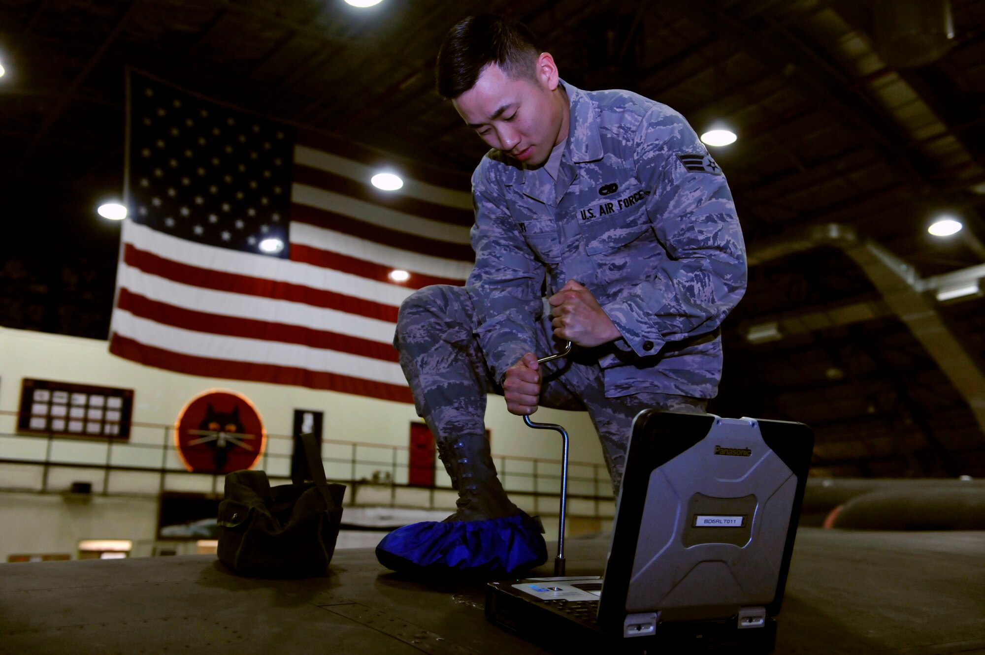 Senior Airman David Yi, 5th Reconnaissance Squadron U-2 fuel systems journeyman, installs a panel which houses a fuel system pressure relief valve on a U-2 aircraft April 22 in a hangar on Osan Air Base, Republic of Korea. Yi is this week’s Airman Spotlight winner. (U.S. Air Force photo by Senior Airman David Owsianka)