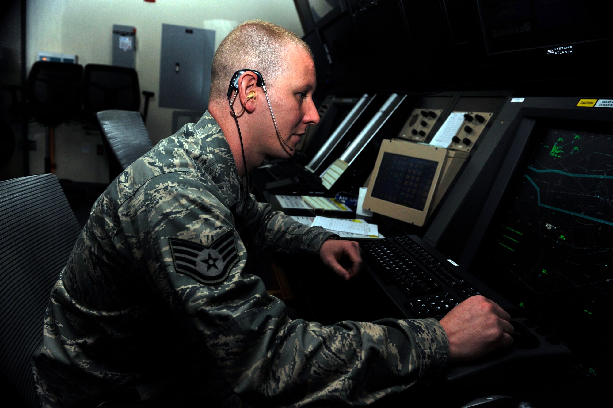 Staff Sgt. Brandon Dick, 51st Operations Support Squadron air traffic control watch supervisor, looks at an air traffic control scope to ensure aircrafts are far enough separated May 12 in the central Korea airspace on Osan Air Base, Republic of Korea. Dick is this week's Airman Spotlight winner. (U.S. Air Force photo by Senior Airman David Owsianka)
