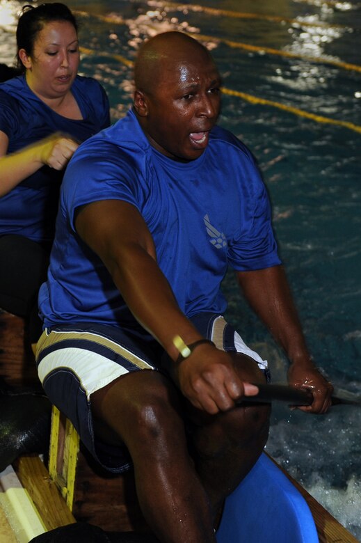 U.S. Air Force Master Sgt. Timothy Middleton, 18th Operation Support Squadron air crew flight equipment heavy operations section chief, rows along with his team at practice on Naha Air Base, Japan, March 26, 2014. Middleton, who coached for the first time in 2014, rowed on the Kadena dragon boat team during his previous assignment to Kadena Air Base in 2006. (U.S. Air Force photo by Airman 1st Class Zade C. Vadnais)
