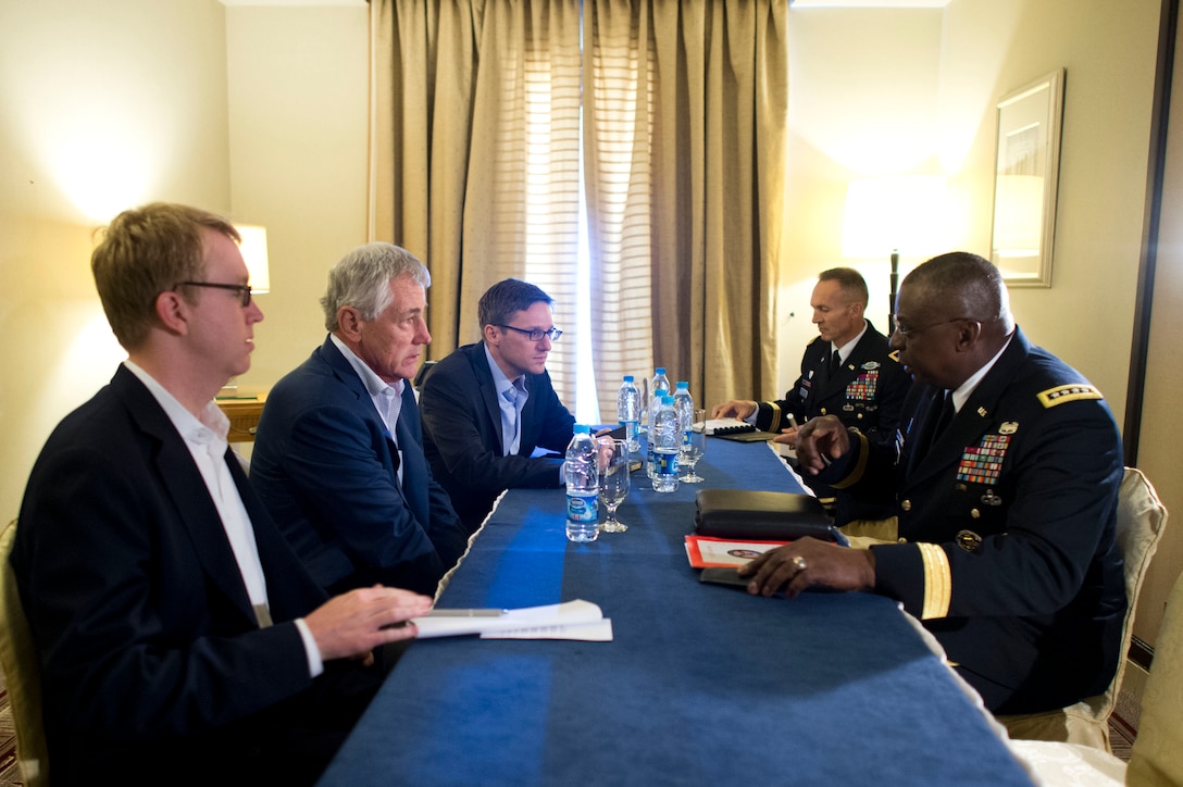 U.S. Defense Secretary Chuck Hagel, left, meets with U.S. Army Gen. Lloyd J. Austin III, commander of U.S. Central Command, in Jeddah, Saudi Arabia, May 13, 2014.