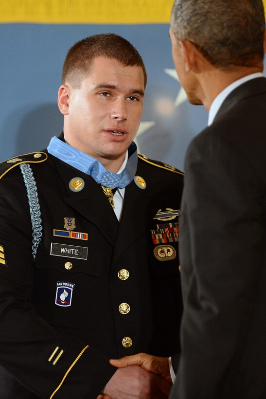 Former Army Sgt. Kyle J. White shakes hands with President Barack Obama, who awarded him the Medal of Honor for conspicuous gallantry during a ceremony at the White House, May 13, 2014.
