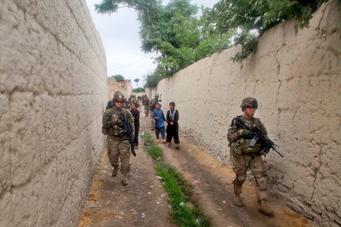 U.S. soldiers patrol through Kajir Kheyl village in Afghanistan’s Khowst province, June 12, 2013. The U.S. soldiers have partnered with Afghan national security forces to establish relationships with key village elders and learn about the needs of residents. 
