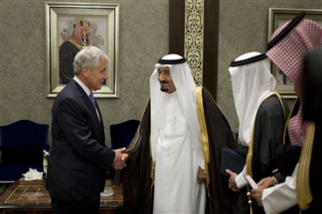 U.S. Defense Secretary Chuck Hagel shakes hands with Saudi Crown Prince Salman bin Abdulaziz Al Saud, who also serves as first deputy prime minister and defense minister, before a meeting in Jeddah, Saudi Arabia, May 13, 2014. The two defense leaders discussed regional threats and challenges, including Iran and Syria, and the importance of maintaining close cooperation on these and other issues in the region.