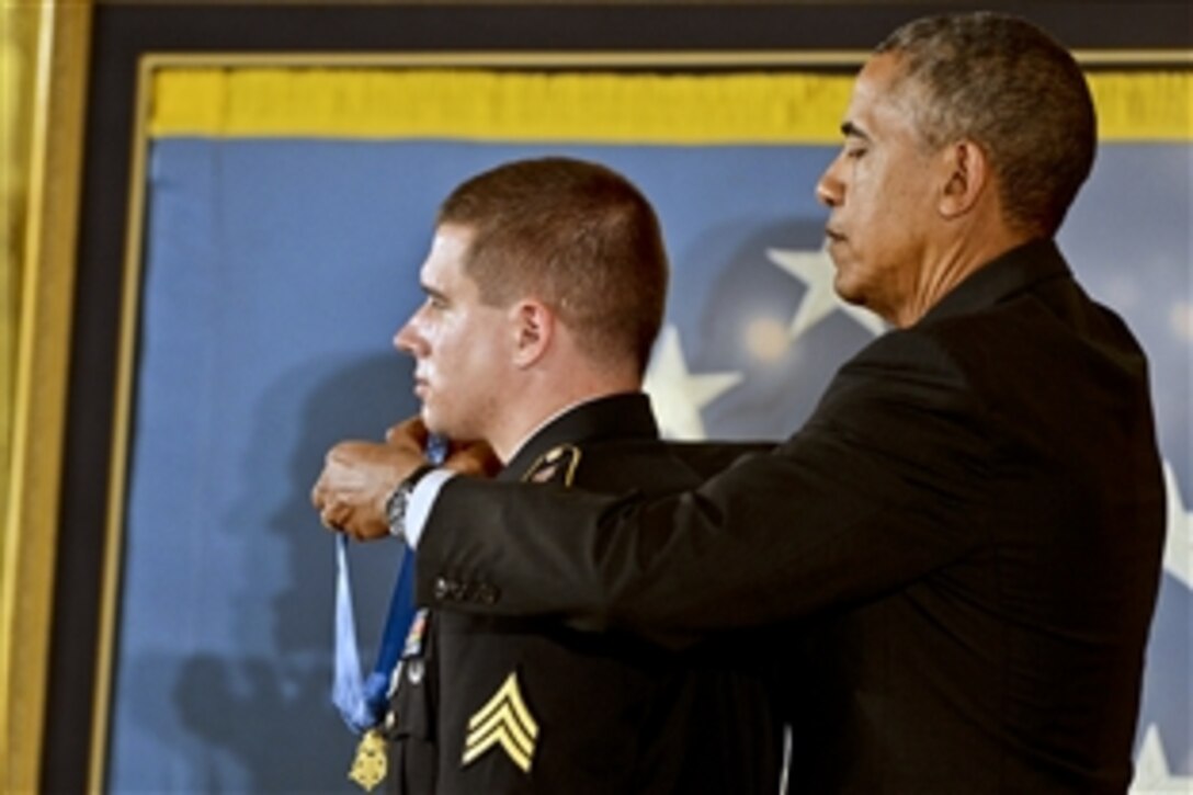 President Barack Obama awards former Army Sgt. Kyle J. White the Medal of Honor for conspicuous gallantry during a ceremony at the White House, May 13, 2014. White received the medal for courageous actions while serving as a platoon radio telephone operator during combat operations against an armed enemy in Afghanistan's Nuristan province, Nov. 9, 2007.