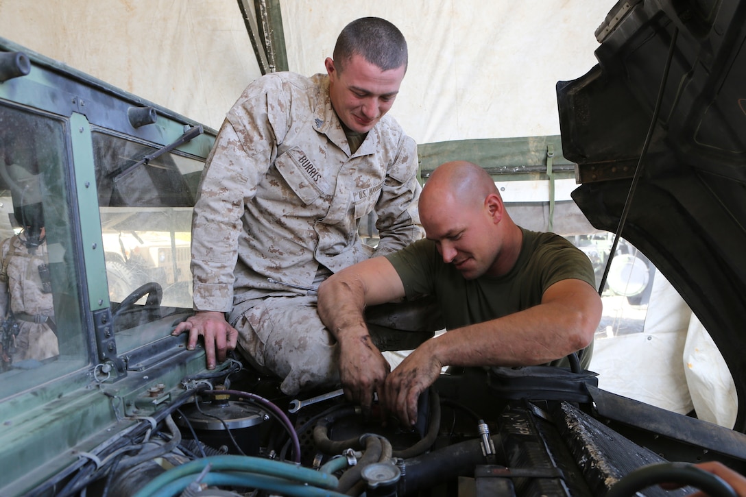 Corporal Cody Burris, left, a 22-year-old of Amelia, Ohio, and Sgt. Rodney Gleisner, right, a 28-year-old of Watertown, N.Y., both maintenance mechanics, Maintenance Detachment, Combat Logistics Battalion 15, 1st Marine Logistics Group, repair a Humvee during the battalion's first field training exercise of the year at Red Beach aboard Camp Pendleton, Calif., May 6-10, in preparation for pre-deployment training with the 15th Marine Expeditionary Unit this fall. The exercise allowed CLB-15 to practice procedures and protocols they will apply while acting the 15th MEU's primary logistical support element during its deployment early next year. Providing this support to the MEU allows it to focus on its chief objective as a crisis response force, ready to respond to disaster or humanitarian relief operations.