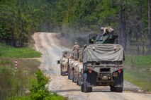 Marines with Combat Logistics Battalion 2, Combat Logistics Regiment 2, 2nd Marine Logistics Group and 10th Marine Regiment, 2nd Marine Division fire M-240 medium machine guns and M-2 .50-caliber machine guns to train for convoy security during Rolling Thunder, a biannual training exercise at Fort Bragg, N.C., May 8, 2014. The training allowed Marines with both units to hone their skills and gave experienced service members an opportunity to pass on their knowledge. 