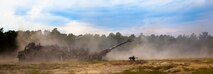 A M-777 howitzer manned by Marines with Fox Battery, 2nd Battalion, 10th Marine Regiment, rests in a cloud of smoke and dust after firing during Rolling Thunder, a biannual training exercise at Fort Bragg, N.C., May 9, 2014. Rolling Thunder tested the regiment’s ability to perform fire missions while receiving support from a logistics combat element comprised of service members from 2nd Marine Logistics Group.