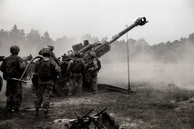 Marines with Fox Battery, 2nd Battalion, 10th Marine Regiment prepare to reload a M-777 howitzer during a fire mission conducted during Rolling Thunder, a biannual training exercise at Fort Bragg, N.C., May 9, 2014. The exercise trained the regiment for fire missions at longer ranges than are possible aboard Camp Lejeune, N.C., the unit’s home station. 