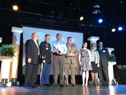 (Left to right) J. D. Elliott, president of the Memorial Foundation; Lt. Col. John L. Hudson, U.S. Army Corps of Engineers Nashville District commander; Bob Sneed, Nashville District Water Management Section chief; Michael Steele, executive principal at Stratford STEM Magnet High School; Jennifer Berry, academy coach at Stratford; Janet Wallace, associate principal at Stratford; and Jeff Davis, associate principal at Stratford; pose during the Externship of the Year Award  presentation at the 2014 Academies of Nashville Awards hosted by the chamber of commerce May 12, 2014 at Rocketown in Nashville, Tenn. 