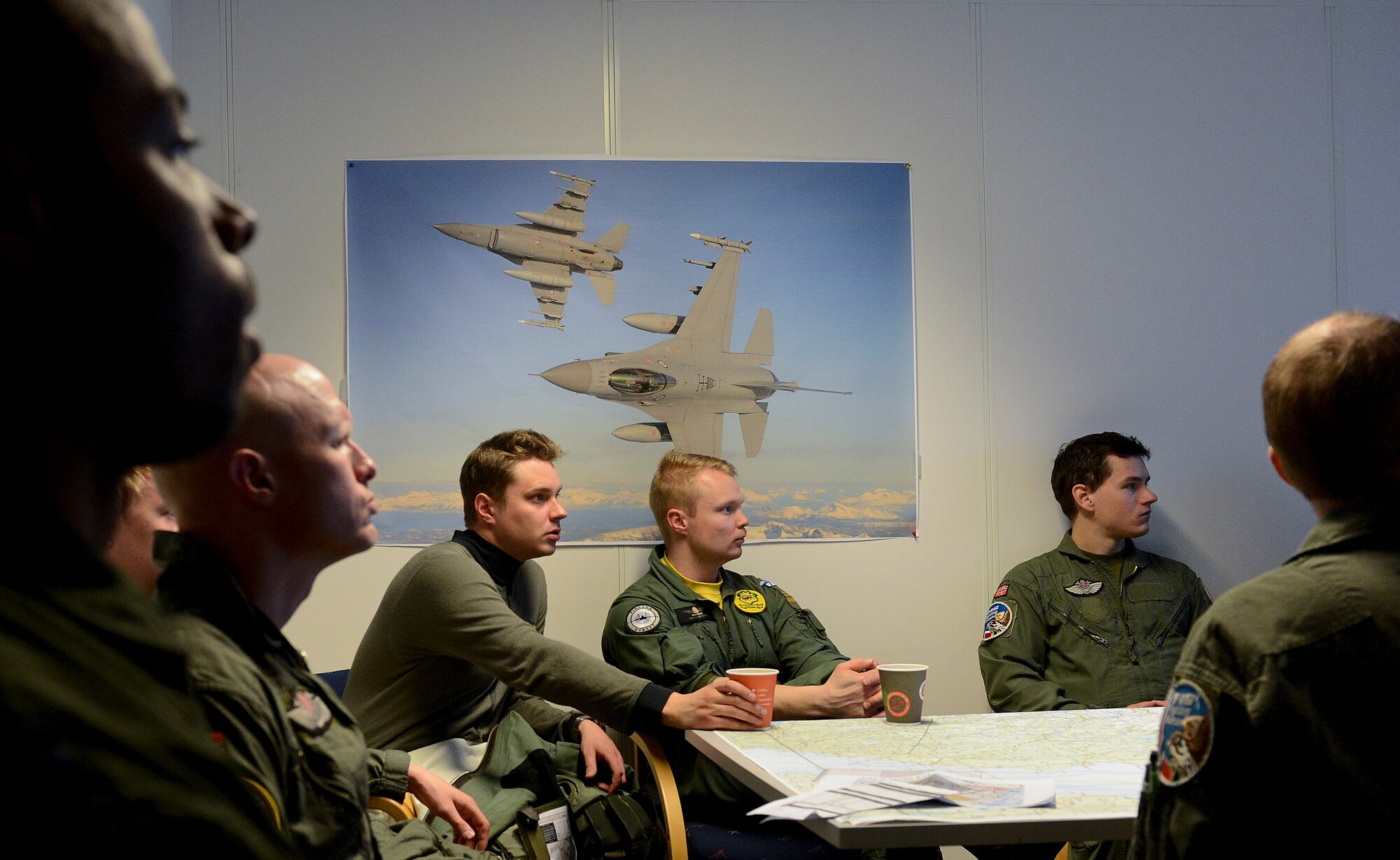 U.S., Swedish, Norwegian and Finnish air force aircrew debrief May 7, 2014, after a training mission at Bodo Main Air Station, Norway. The U.S. Air Force worked side-by-side with European allies and partners in the Nordic Defense Cooperation exercise to ensure security, protect global interests, and aid economic bonds. (U.S. Air Force photo/Airman 1st Class Trevor T. McBride)