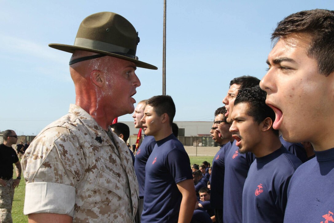 Sergeant Joseph W. Wooden, a drill instructor from Marine Corps Recruit Depot San Diego, gives future Marines a taste of what recruit training will be like, at Port Hueneme, May 3. Marines with Recruiting Station Los Angeles gathered hundreds of poolees, young men and women who have enlisted but not yet left for boot camp, to compete in an annual field meet. During the day, four drill instructors demonstrated the activities that would take place once the poolees begin recruit depot. 