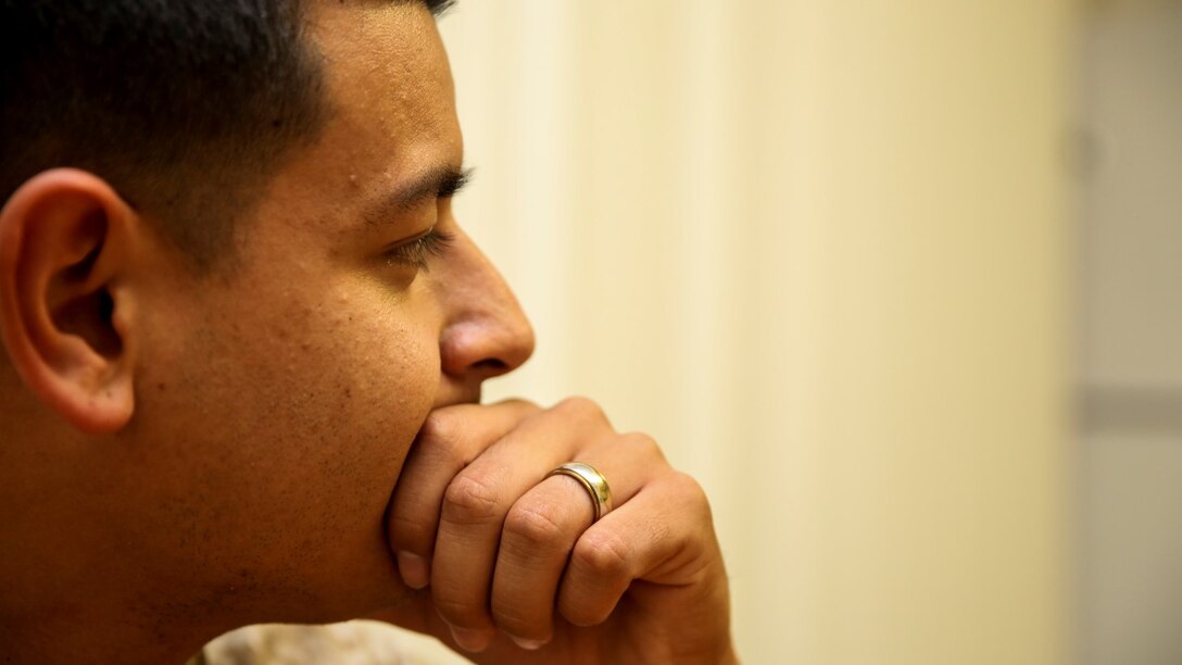 Corporal Alberto Perez III, left, administrative specialist, 15th Marine Expeditionary Unit, takes a moment to appreciate how the Marine Corps has made him a better person aboard Camp Pendleton, Calif., May 8, 2014. Perez, 22, is from Burbank, Calif. (U.S. Marine Corps photo by Cpl. Emmanuel Ramos/Released)