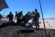 Marines with Lima Battery, 3rd Battalion, 11th Marine Regiment, demonstrate the set up of an M777 lightweight howitzer during a partnership with the Make-A-Wish foundation at Marine Corps Air Ground Combat Center Twentynine Palms May 13, 2014. Ryan Forbes, a 13 year-old native of San Diego was an honorary Marine for a day with the battery and learned about the lifestyles of the Marines. He was accompanied by his parents and brother, and attended training with the battery, learning how to set up and take down an M777 howitzer and eating lunch with a section. He was diagnosed with medulloblastoma, a form of brain cancer in January but his diagnosis and current treatment hasnt hampered his enthusiasm for the military.