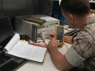 A Marine calibrates a multimeter, a device used to measure properties of electricity such as voltage, current and resistance, using the multimeter workstation standards from the Expeditionary Test, Diagnostic and Measurement Equipment Maintenance System. The ETMS lets Marines calibrate test equipment in 28 different test areas. 