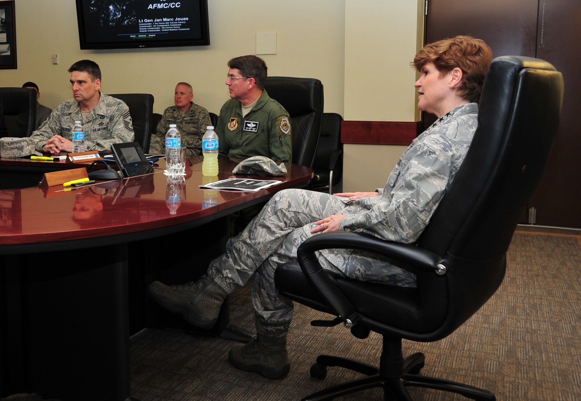 Gen. Janet Wolfenbarger, Air Force Materiel Command commander, receives a 7th Air Force mission briefing from Lt. Gen. Jan-Marc Jouas, 7th Air Force commander, at the 7th AF headquarters on Osan Air Base, Republic of Korea, May 14, 2014. D...uring her visit, she toured the 607th Air and Space Operations Center and spoke with 7th AF leadership about AFMC's contribution to the command's mission in the Republic of Korea. Wolfenbarger was one of the first female cadets to graduate from the U.S. Air Force Academy and the first female four-star general in the Air Force. (U.S. Air Force photo by Tech. Sgt. Thomas J. Doscher)
