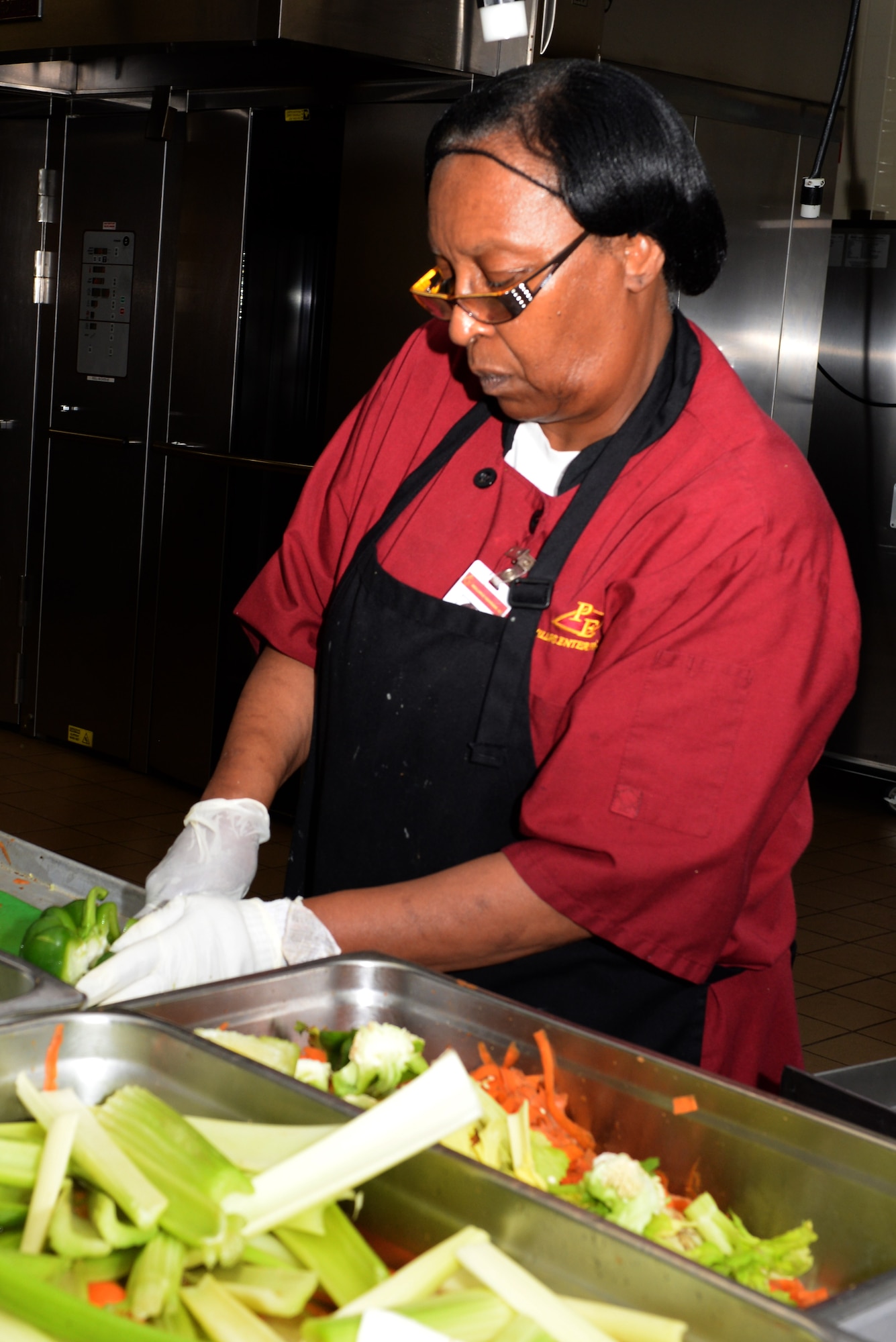 Dorothy Savage, a Warriors’ Café employee, prepares vegetables for stir-fry at Fort Eustis, Va., May 13, 2014. The dining facility opened in May 2013. (U.S. Air Force photo by Senior Airman Teresa J.C. Aber/Released)