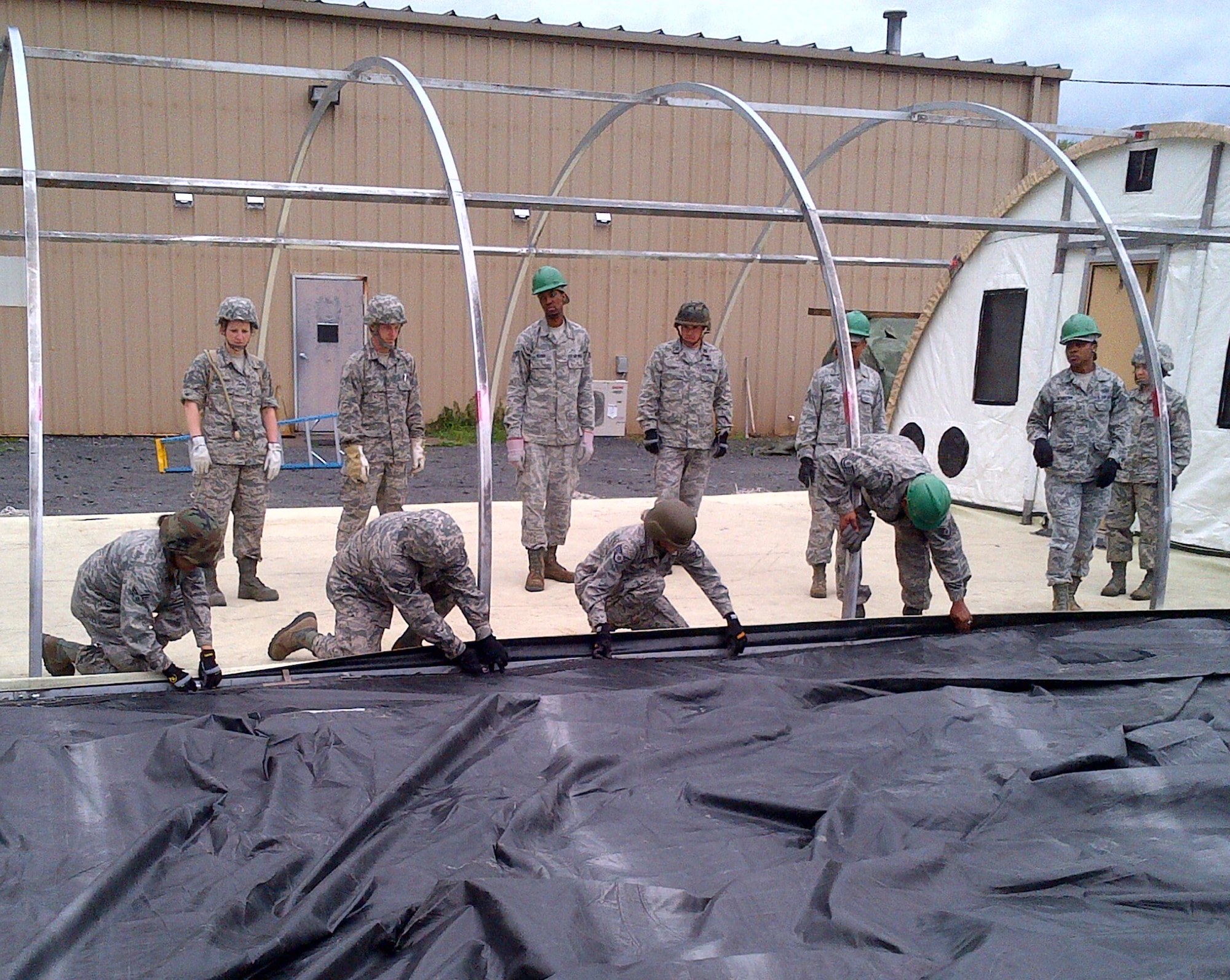 Airmen of all Air Force components work to construct a tent during a Silver Flag exercise, April 30, 2014 Dobbins Air Reserve Base Georgia. During the week-long course, 914th Airlift Wing Airmen from the Force Support Squadron —Services and Personnel Support for Contingency Operations, PERSCO, —built and maintained bare-base operations at mock forward-deployed locations as well as honed a variety of AFSC-related skills. (U.S. Air Force courtesy photo)