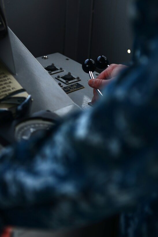 U.S. Navy Chief Petty Officer James Devers, boatswain mate and craft master student, uses his training to control a landing craft utility at Fort Eustis, Va., May 12, 2014. Devers is one of 12 students who took part in the six week Craft Master Course. Devers hails from Memphis, Tenn. (U.S. Air Force photo by Airman 1st Class Kimberly Nagle/Released)