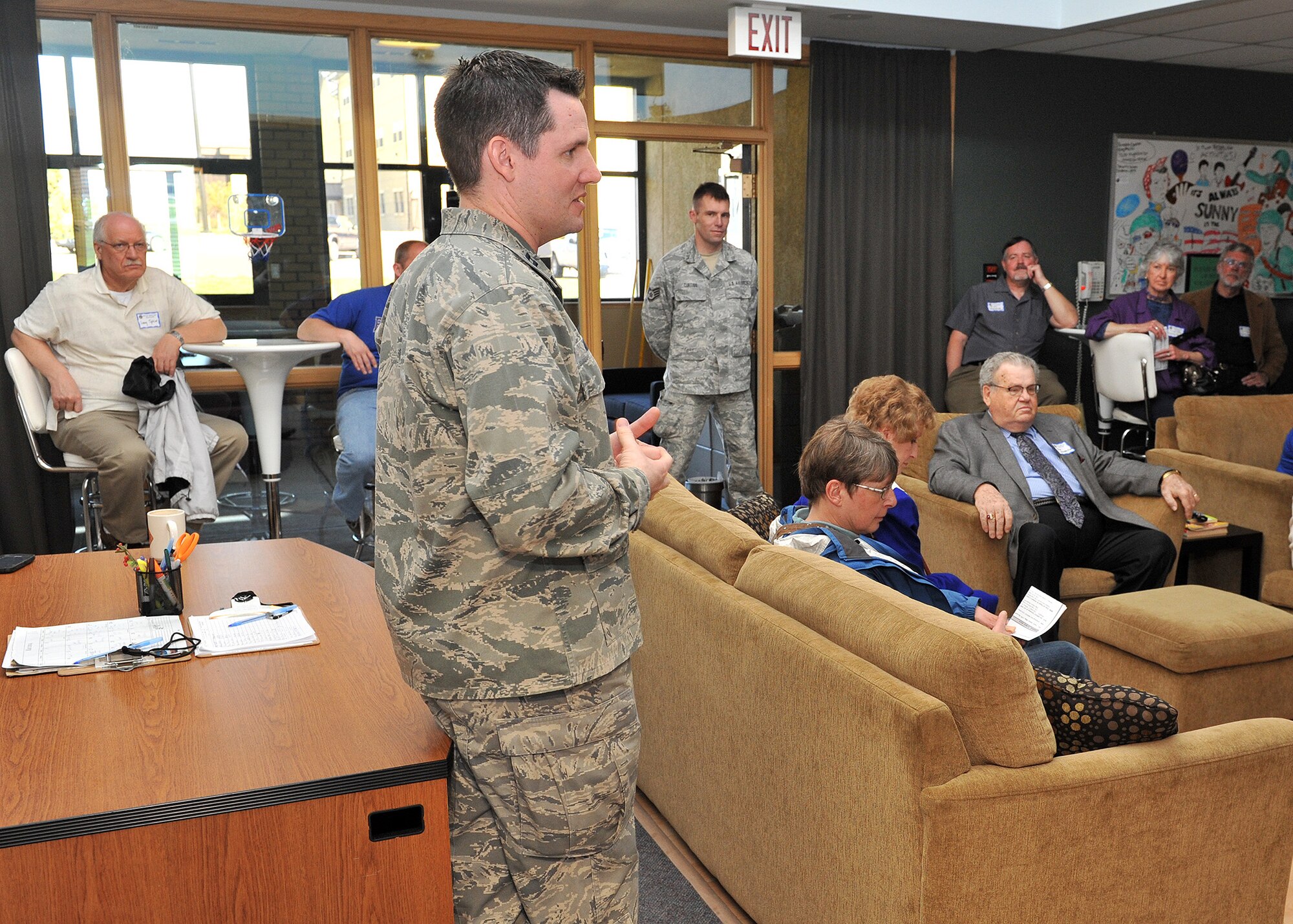 Chaplain (Capt.) Robert Mohr, 341st Missile Wing chaplain, describes the operation of the Airman Ministry Center—commonly known as the Detour Center—to approximately 25 religious leaders from the Great Falls, Mont., area during Clergy Day activities May 13. The Detour Center is sponsored by the 341st MW Chaplain Corps and provides a means for chaplains to interact with Airmen in the grades of E-1 through E-4. (U.S. Air Force photo / John Turner)