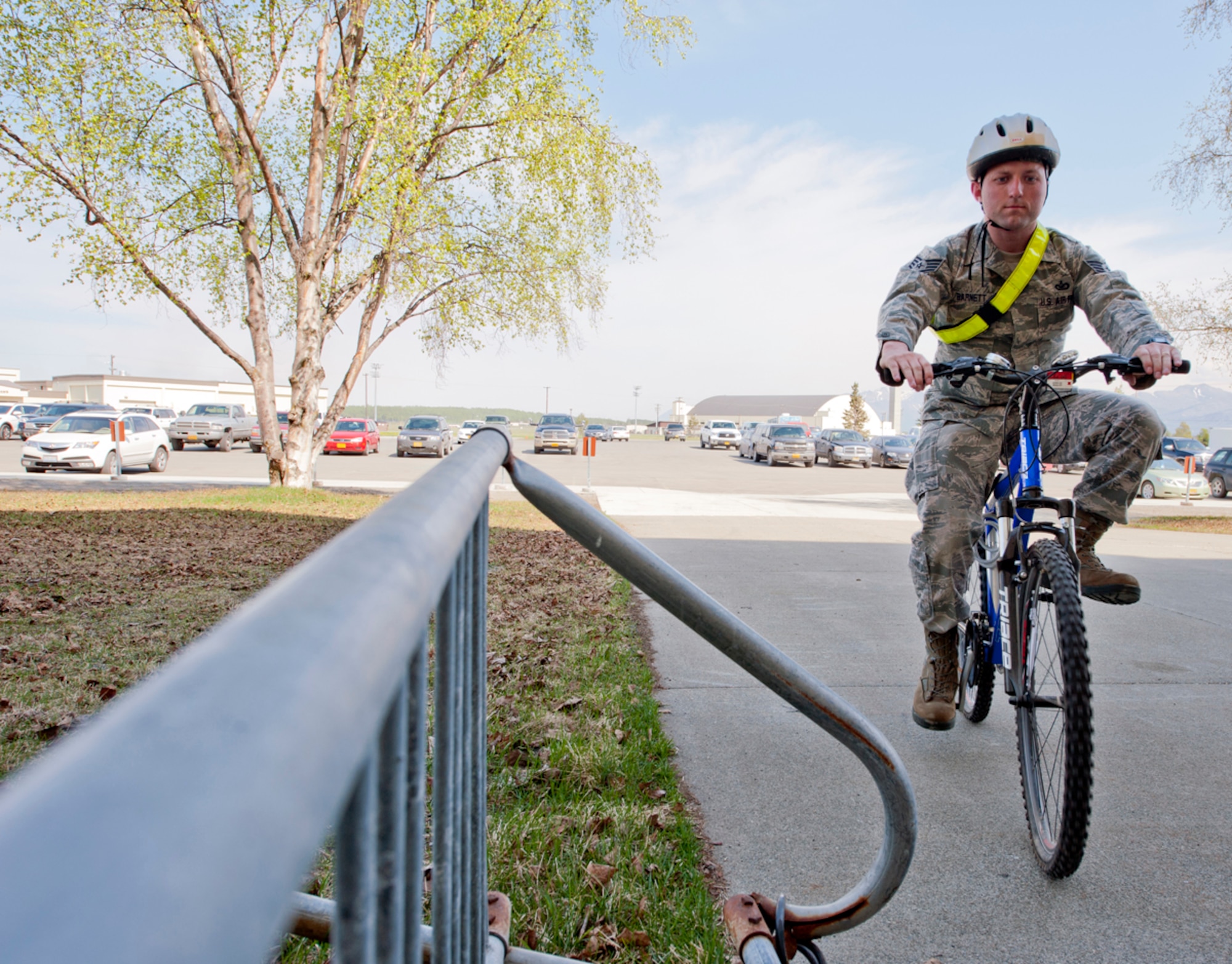 Air Force Staff Sgt. Robert Barnett, 673d Public Affairs photojournalist, bikes to work on Joint Base Elmendorf-Richardson, Alaska, May 13, 2014. May is fitness month and bicycling month is part of the fitness month. Bicycling has many benefits such as saving individuals money on gas, getting physically active as they commute, and enjoying the great outdoors. (U.S. Air Force photo/Airman 1st Class Tammie Ramsouer)