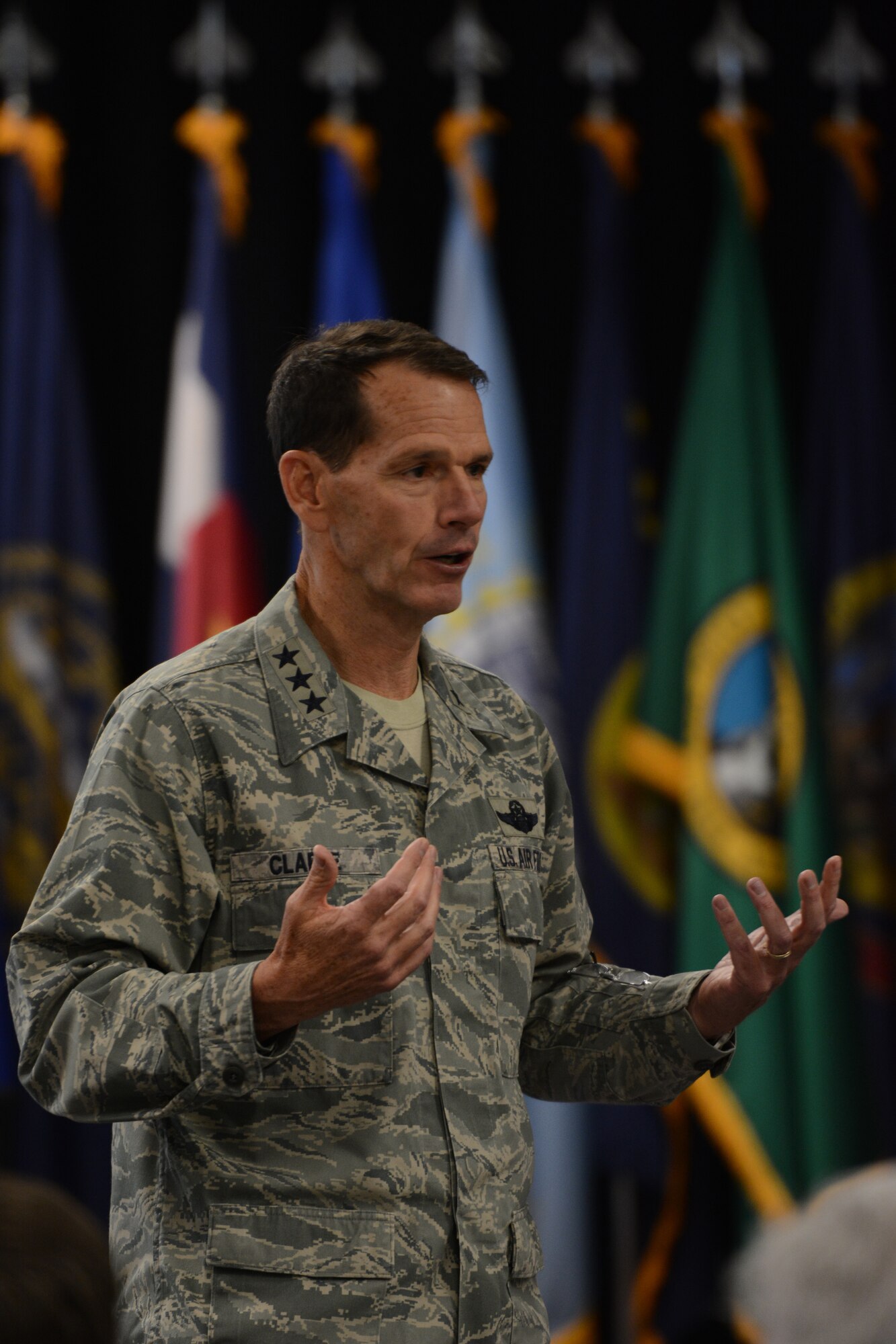 Lt. Gen. Stanley E. Clarke III, Air National Guard director, speaks to general officers from around the nation during the 2014 Air National Guard Executive Safety Summit at Volk Field Air National Guard Base, Wis., May 13, 2014. The summit taught leaders about a variety of topics including social media, budget, fitness and readiness. (Air National Guard photo by Senior Airman Andrea F. Liechti)