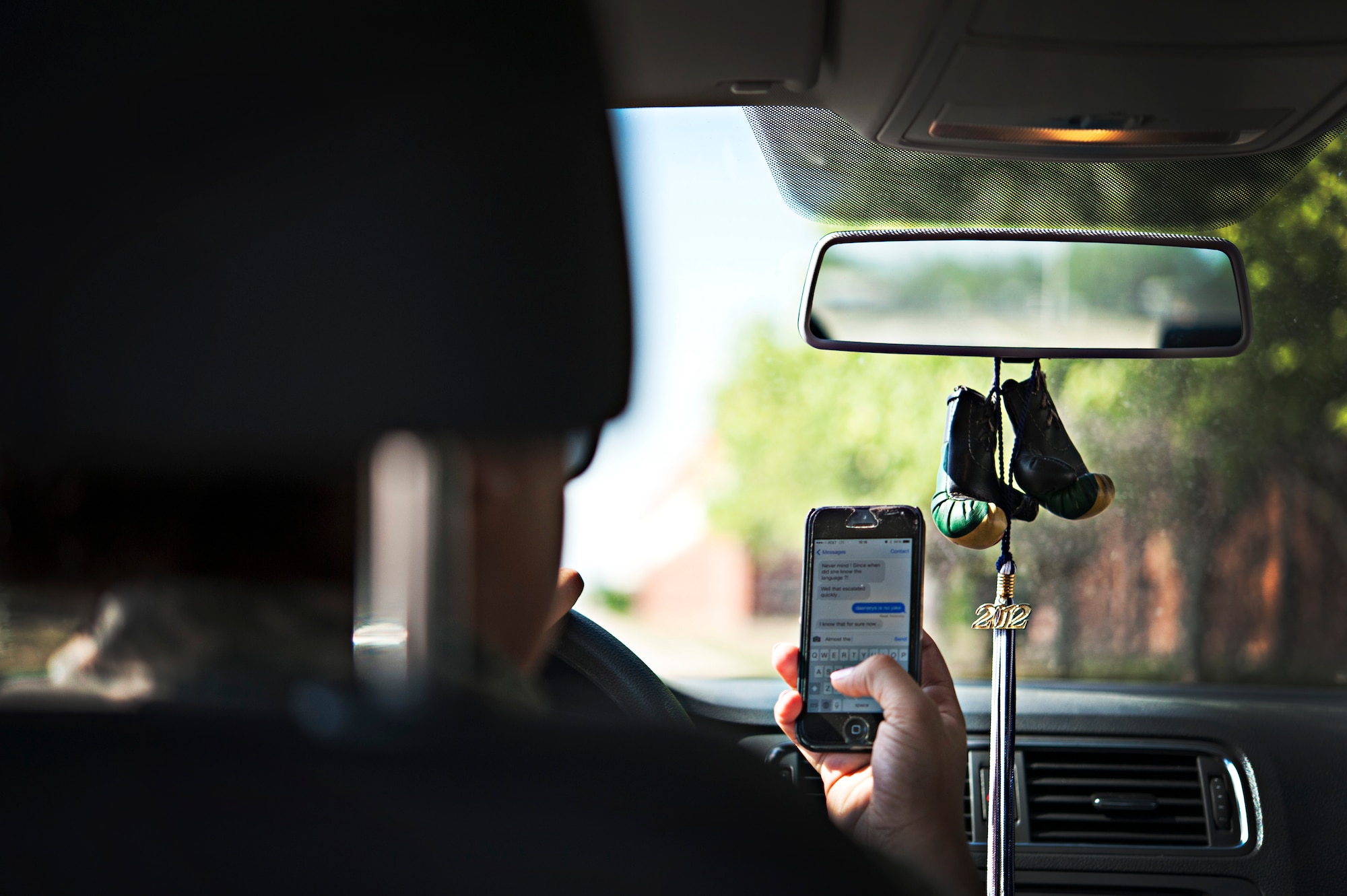 GOODFELLOW AIR FORCE BASE, Texas -- Due to an increase of driving accidents across the United States, cell phone usage while driving has been prohibited on Goodfellow and across installations throughout the world. Vehicle operators on a Defense Department installation and operators of government owned vehicles shall not talk or text on cell phones unless the vehicle is safely parked or unless they are using a hands-free device. (U.S. Air Force photo illustration/ Senior Airman Michael Smith)