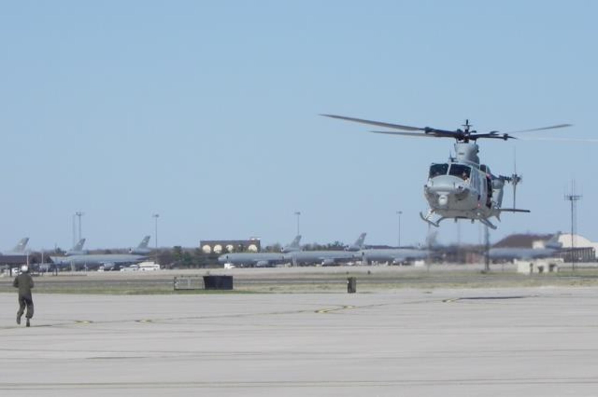 Capt. Sean Hicks, Defensive Contract Management Agency pilot; Capt. Daniel Turaj, Marine Light Attack Helicopter Squadron (HMLA) 773 pilot, and Gunnery Sgt. Jason Joly, DCMA crew chief, land the second UH-1Y Yankee to arrive at HMLA-773 April 25, 2014, at Joint Base McGuire-Dix-Lakehurst, N.J. HMLA-773 received a total of three Yankees at each of the squadron’s three detachments as part of a fleet upgrade from the UH-1N Huey. (U.S. Marine Corps courtesy photo/Released) 