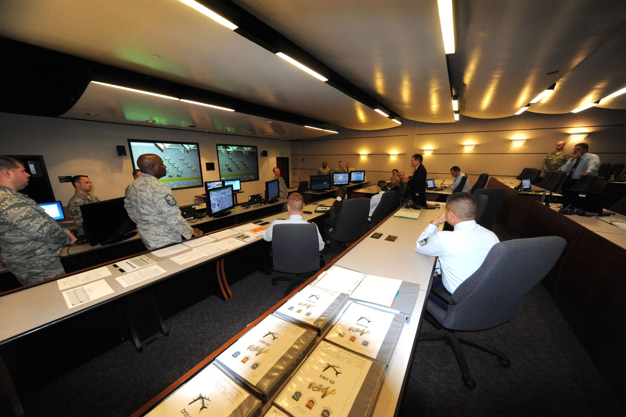 JOINT BASE MCGUIRE-DIX-LAKEHURST, N.J.--Seven chief learning officers from companies across the nation receive a Mobility Operations School Technology and Learning tour here May 9, 2014.  Dr. Darcy Lilley, Air Mobility Command's chief learning officer, hosted the event and discussion alongside members of the U.S. Air Force Expeditionary Center’s Learning Transformation office. (U.S. Air Force photo by Danielle Brooks)