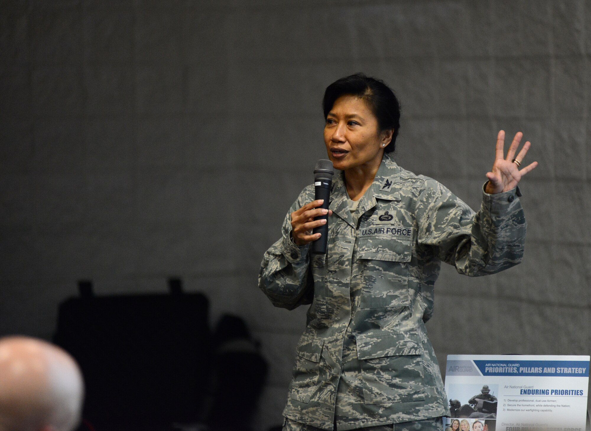 Col. Shirley S. Raguindin addresses wing commanders on the importance of diversity at the 2014 Executive Safety Summit, held at Volk Field Combat Readiness Training Center, Wis., May 13-14, 2014. This year's theme: "Leaders: Don't Let Your Guard Down," covers a wide range of topics including safety, resilience,diversity and mishap prevention. (U.S. Air National Guard photo by Senior Airman John E. Hillier/Released)