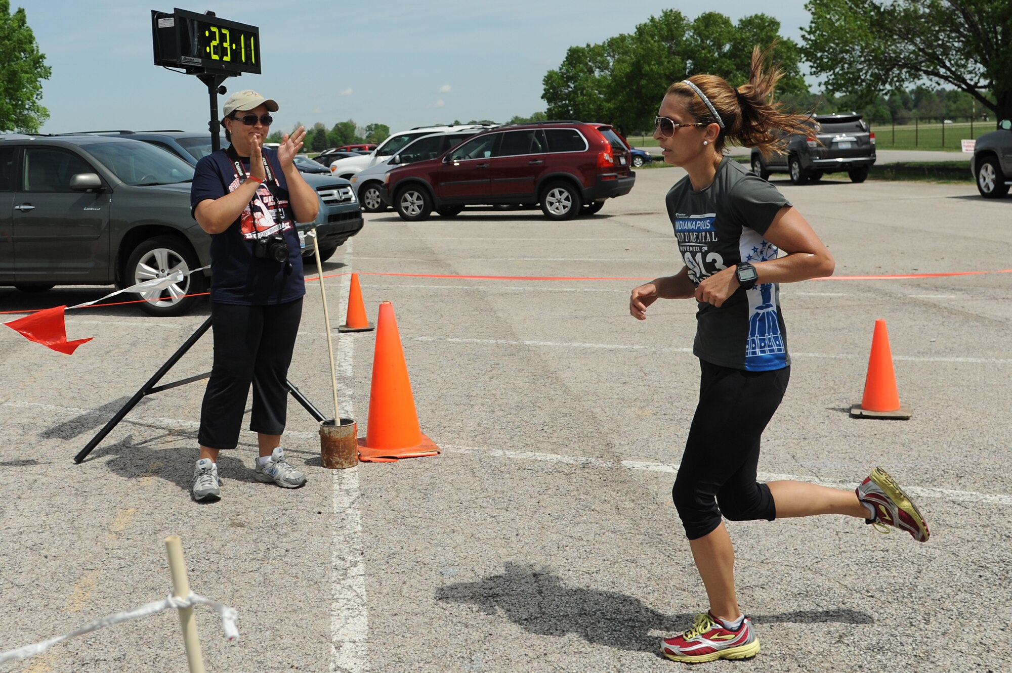 To promote Military Spouse Appreciation Day, and to give thanks to the spouses on Scott Air Force Base, the spouses held a 5K run for all who have access to the base May 9, 2014, Scott AFB, Ill. Participants arrived in teal outfits, capes, and headbands. Some individuals ran with their kids, or even let their kids run. Awards were given to the fastest male and female, and the first kid to cross the finish line. (U.S. Air Force Photo/ Senior Airman Tristin English)