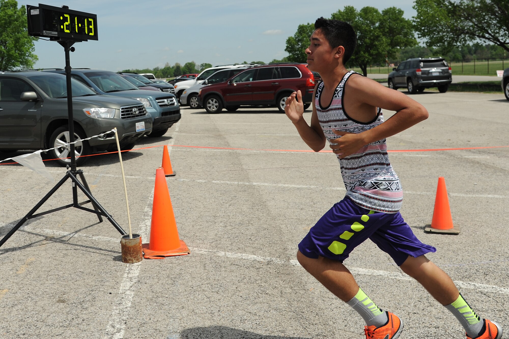 To promote Military Spouse Appreciation Day, and to give thanks to the spouses on Scott Air Force Base, the spouses held a 5K run for all who have access to the base May 9, 2014, Scott AFB, Ill. Participants arrived in teal outfits, capes, and headbands. Some individuals ran with their kids, or even let their kids run. Awards were given to the fastest male and female, and the first kid to cross the finish line. (U.S. Air Force Photo/ Senior Airman Tristin English)