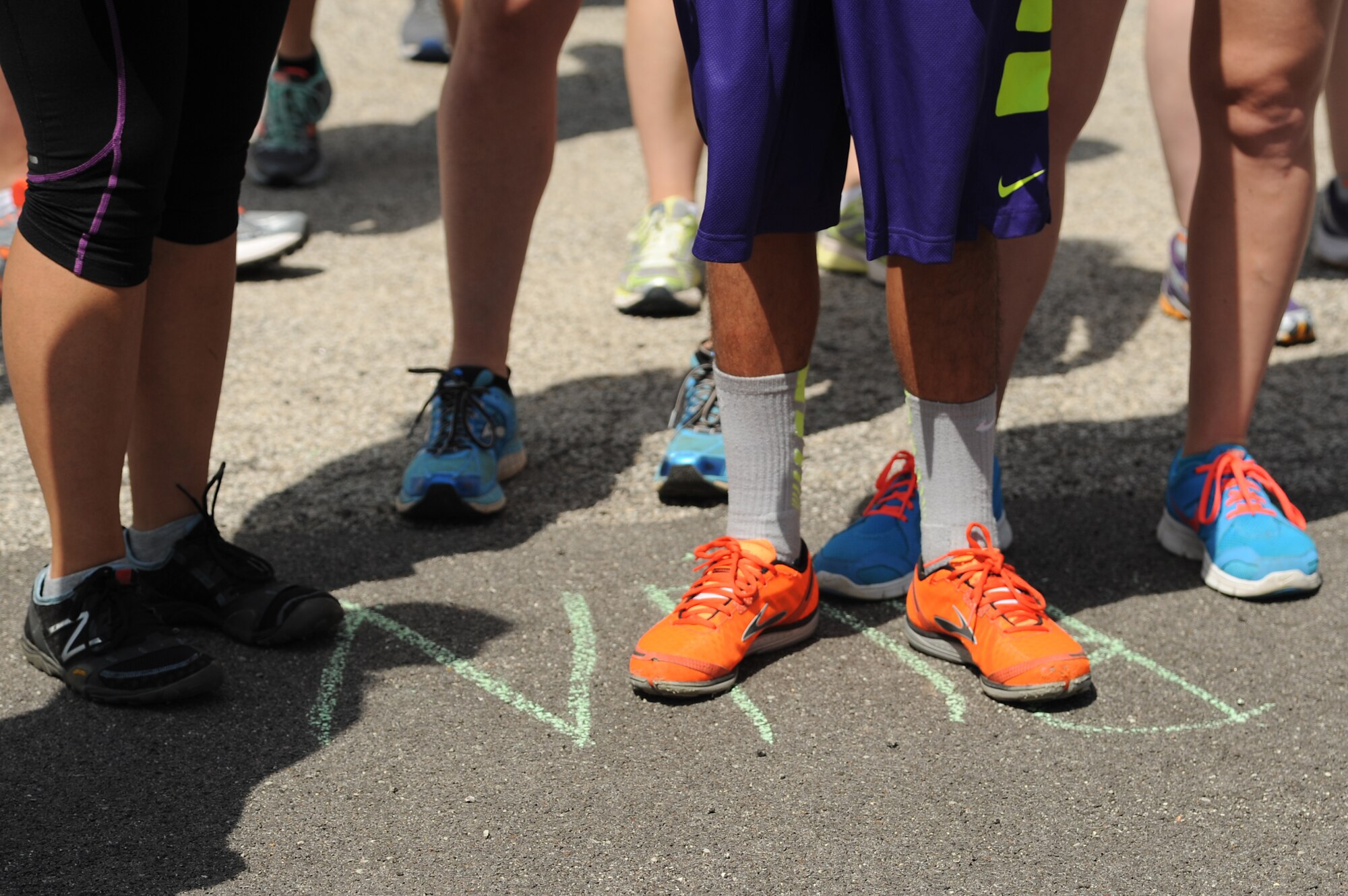 To promote Military Spouse Appreciation Day, and to give thanks to the spouses on Scott Air Force Base, the spouses held a 5K run for all who have access to the base May 9, 2014, Scott AFB, Ill. Participants arrived in teal outfits, capes, and headbands. Some individuals ran with their kids, or even let their kids run. Awards were given to the fastest male and female, and the first kid to cross the finish line. (U.S. Air Force Photo/ Senior Airman Tristin English)