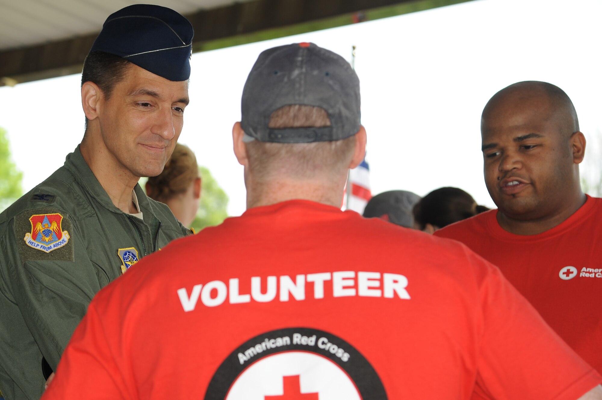 Col. Kyle Kremer, 375th Air Mobility Wing commander, talks to the American Red Cross during Military Spouse Appreciation Day May 9, 2014, Scott AFB, Ill. To promote Military Spouse Appreciation Day, and to give thanks to the spouses on Scott Air Force Base, the spouses held a 5K run for all who have access to the base. (U.S. Air Force Photo/ Senior Airman Tristin English)
