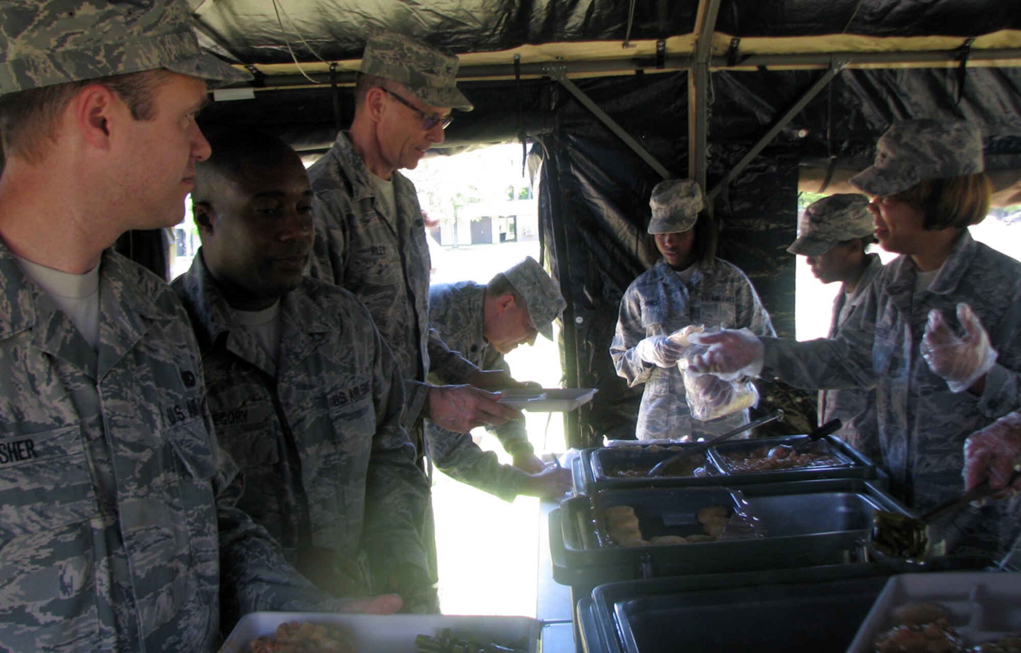 Members of the 403rd Services Sustainment Flight served a hot meal
"in-the-field" at Keesler Air Force Base, Mississippi, May 3, 2014 as part of the 403rd Mission Support Group's Functional Area Training Event. (U.S. Air Force photo)