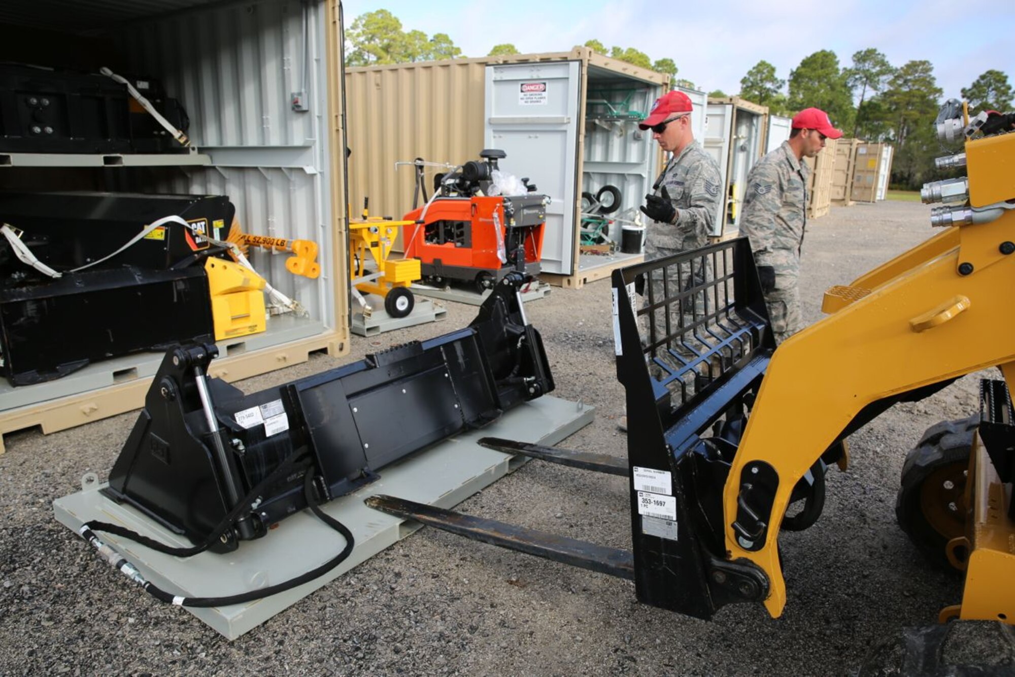 Tech. Sgt. Jason Ward, Detachment 1, 823rd RED HORSE Squadron, guides the placement of one of the sustainment pavement repair kit’s many attachments for a compact tracked loader at the Silver Flag exercise, Tyndall Air Force Base, Fla., on March 11, 2014. The SuPR kit contains equipment, tools and materials to help Air Force civil engineers repair and sustain deployed airfields. It is now part of Air Force civil engineer contingency training at locations like Silver Flag. (U.S. Air Force photo/Eddie Green)