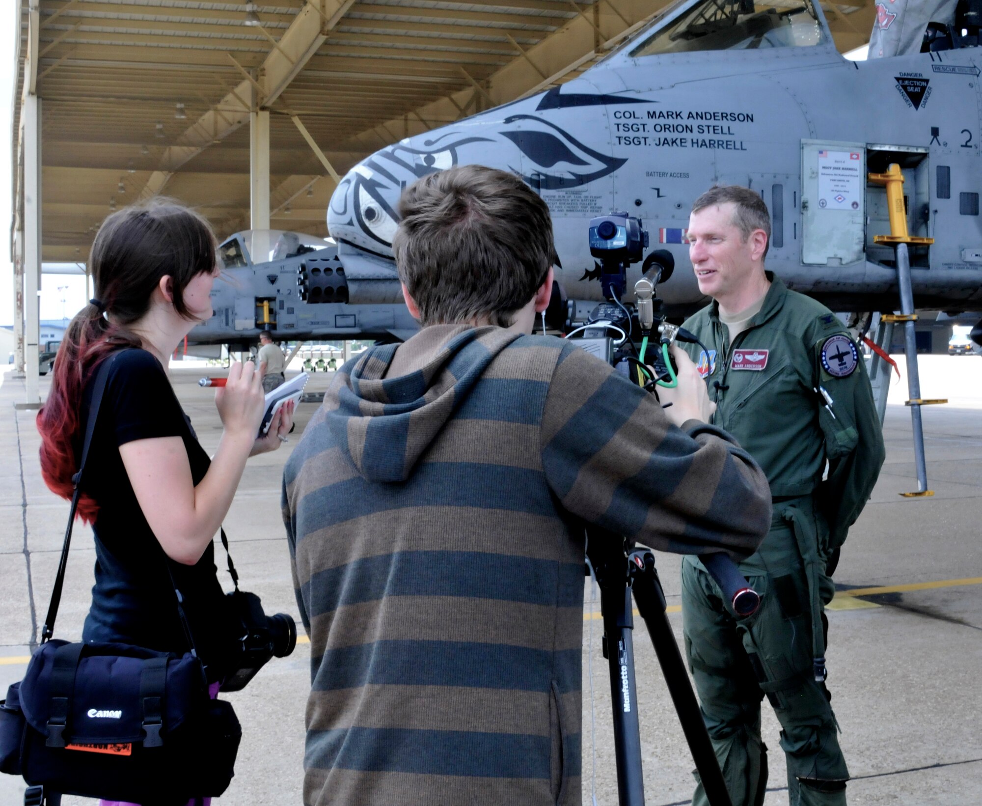 Col. Mark W. Anderson, 188th Fighter Wing commander, speaks with local media following his final training mission in an A-10C Thunderbolt II “Warthog” at Ebbing Air National Guard Base, Fort Smith, Arkansas, May 12, 2014. The ceremonial "fini" flight was Anderson’s final sortie until he flies the last A-10 out of Ebbing ANG Base June 7, 2014, following the wing’s conversion ceremony. The 188th will convert from a fighter mission to a remotely piloted aircraft (MQ-9 Reapers), targeting, intelligence, surveillance and reconnaissance mission (U.S. Air National Guard photo by Tech. Sgt. Josh Lewis/released)  
