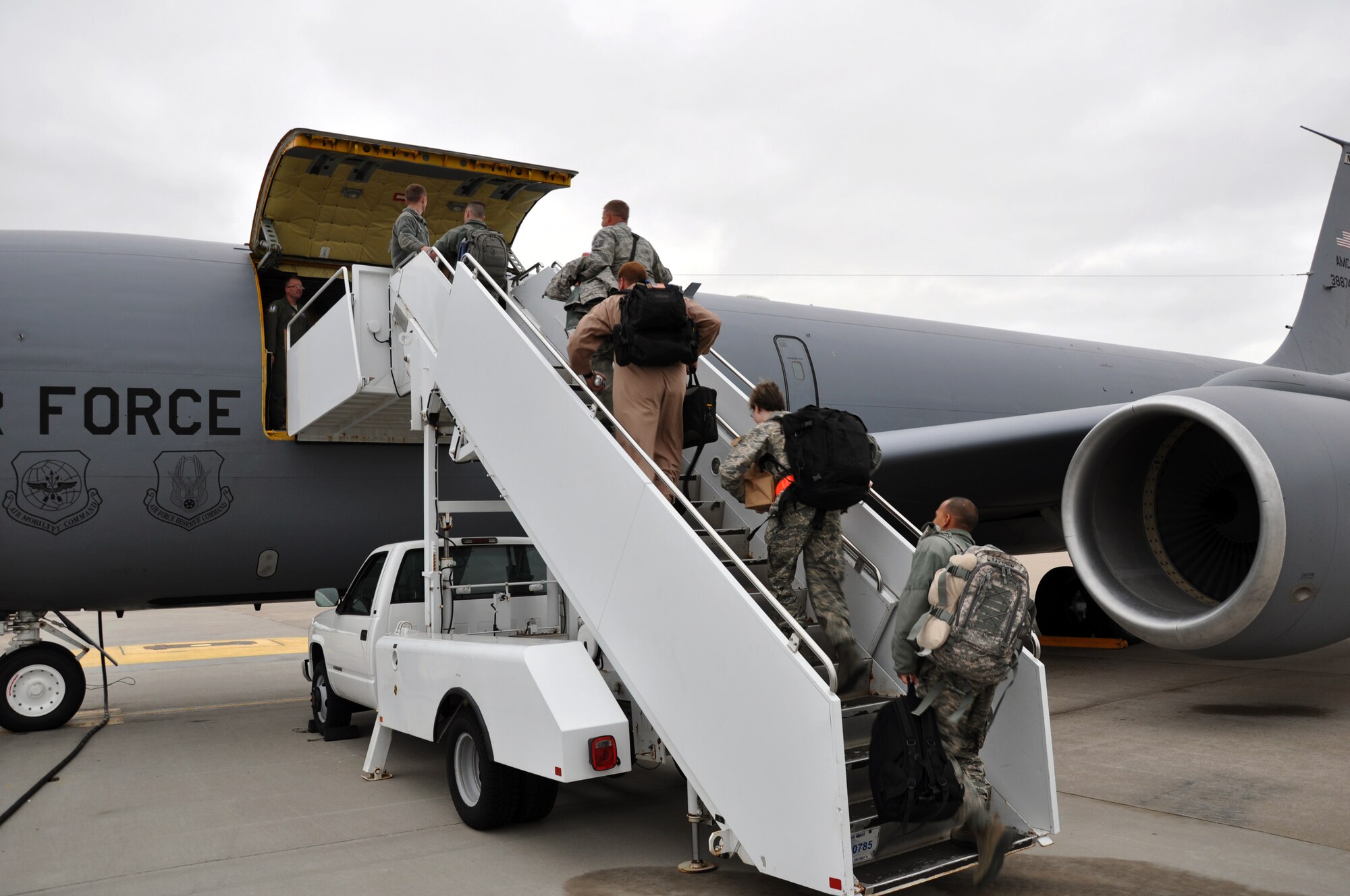 Deploying members of the Air Force Reserve 931st Air Refueling Group board a KC-135 Stratotanker on the flightline at McConnell Air Force Base, Kan., May 12, 2014.  While deployed, aircrew and support personnel the 931st ARG will fly aerial refueling missions, perform aircraft maintenance and fill other support roles while assigned to the 379th Air Expeditionary Wing.  (U.S. Air Force photo by Capt. Zach Anderson)