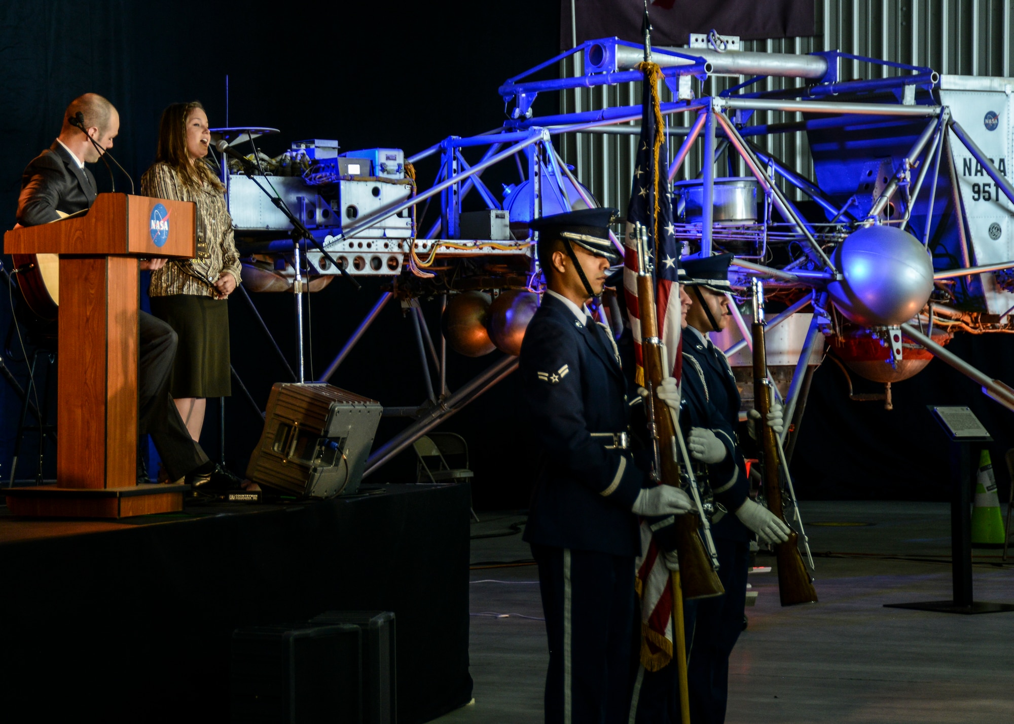 Neil Armstrong’s granddaughter, Kali Armstrong performs the national anthem with the Edwards AFB Blue Eagle Honor Guard during the dedication ceremony for the Armstrong Flight Research Center May 13. (U.S. Air Force photo by Rebecca Amber)
