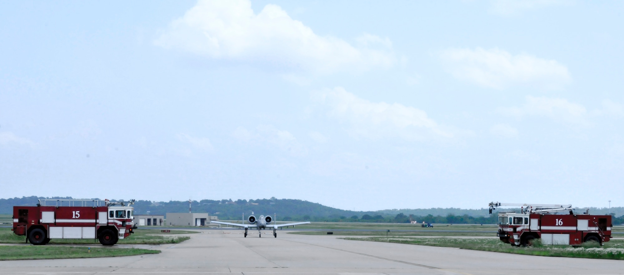 Col. Mark W. Anderson, 188th Fighter Wing commander, is sprayed with water by 188th Fire Emergency Services Flight fire trucks as he returns from his final training mission in an A-10C Thunderbolt II “Warthog”, at Ebbing Air National Guard Base, Fort Smith, Arkansas, May 12, 2014. The ceremonial "fini" flight was Anderson’s final sortie until he flies the last A-10 out of Ebbing ANG Base June 7, 2014, following the wing’s conversion ceremony. The 188th will convert from a fighter mission to a remotely piloted aircraft (MQ-9 Reapers), targeting, intelligence, surveillance and reconnaissance mission (U.S. Air National Guard photo by Tech. Sgt. Josh Lewis/released)  
