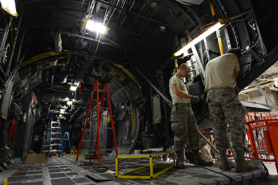 U.S. Airman Staff Sgt. Cameron Blanton from the 139th Maintenance Group, Missouri Air National Guard, teaches Airman First Class Skye Korogodon from the 103rd Maintenance Group (MXG), Connecticut Air National Guard, how to perform an isochronal inspection on the C-130H Hercules aircraft at Rosecrans Air National Guard Base in St. Joseph, Mo., May 13, 2014.  The 103rd MXG recently transitioned to the C-130H from the C-21A Learjet aircraft.  (U.S. Air National Guard photo by Senior Airman Patrick P. Evenson/Released)