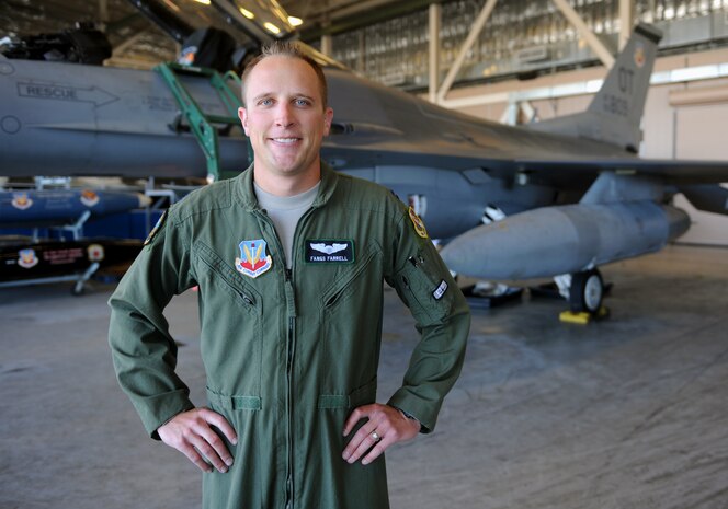 Capt. Gregory Farrell, 422nd Test and Evaluation Squadron F-16 Fighting Falcon operational test instructor pilot, poses for a photo at Nellis Air Force Base, Nev., May 13, 2014. Farrell was recently awarded the Aviation Safety Well Done Award for responding to a mid-air collision while he was flying a training mission over the Atlantic Ocean in August 2013. (U.S. Air Force photo by Senior Airman Siuta B. Ika)